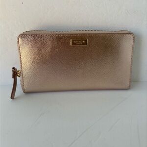 Kate Spade  NWOT Rose Gold Zip Around Leather Wallet